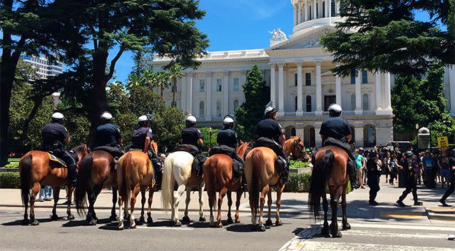 Mounted officers prepare for crowd control at a protest near the Capitol in Sacramento, California, on Sunday. Photo: AP