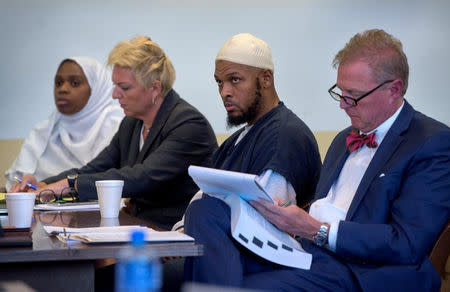 Defendant Jany Leveille (L to R) sits next to her defense lawyer Kelly Golightley, defendant Siraj Ibn Wahhaj and his defense lawyer Tom Clark at hearing in Taos County District Court in Taos County, New Mexico, U.S., August 29, 2018. Eddie Moore/Pool via REUTERS