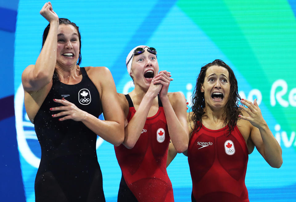 <p>Chantal van Landeghem, Taylor Ruck, and Sandrine Mainville of Canada celebrate third in the final of the Women’s 4 x 100m Freestyle Relay on Day 1 of the Rio 2016 Olympic Games at the Olympic Aquatics Stadium on August 6, 2016 in Rio de Janeiro, Brazil. (Photo by Ian MacNicol/Getty Images) </p>