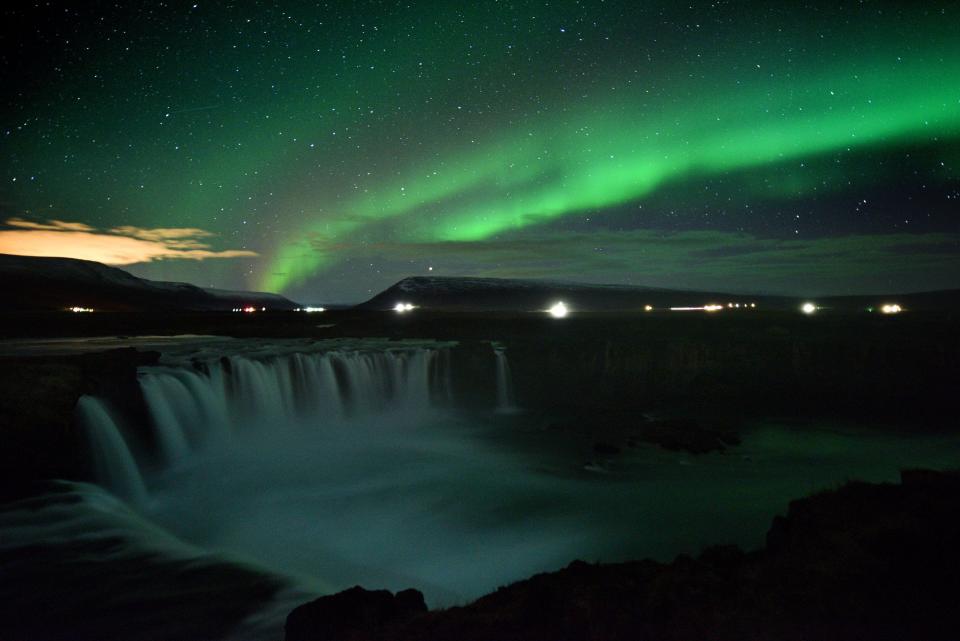 The aurora borealis, also known as Northern Lights, is seen over Godafoss waterfall, in the municipality of Thingeyjarsveit, east of Akureyri, in northern Iceland on Oct. 14, 2018.