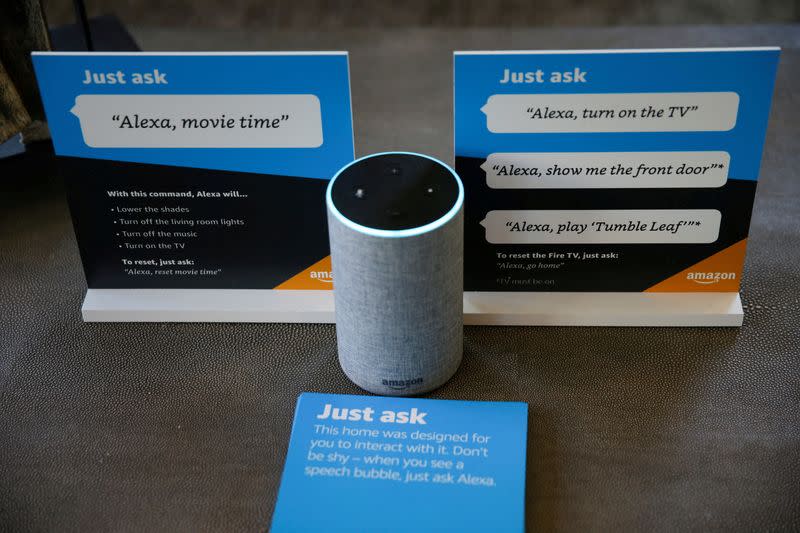 FILE PHOTO: Prompts on how to use Amazon's Alexa personal assistant are seen alongside an Amazon Echo in an Amazon ‘experience center’ in Vallejo