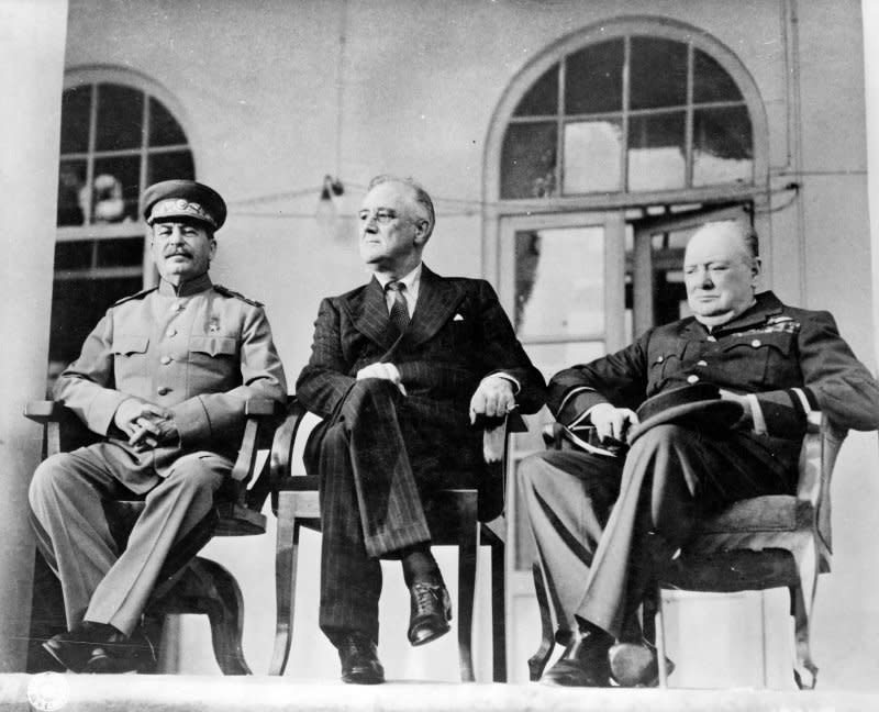On December 1, 1943, ending a "Big Three" meeting in Tehran, U.S. President Franklin Roosevelt, British Prime Minister Winston Churchill and Russian Premier Josef Stalin pledged a concerted effort to defeat Nazi Germany. File Photo by Library of Congress/UPI