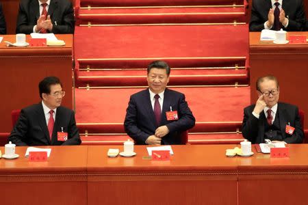 (L to R) Former Chinese president Hu Jintao, Chinese President Xi Jinping and former Chinese president Jiang Zemin are seen during the opening session of the 19th National Congress of the Communist Party of China at the Great Hall of the People in Beijing, China October 18, 2017. REUTERS/Aly Song