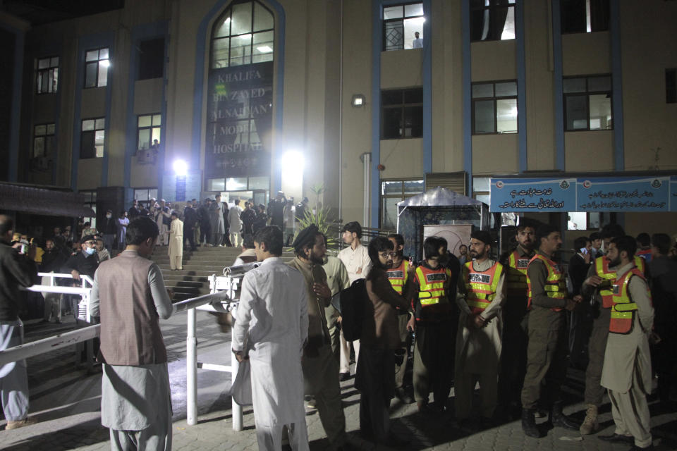 Rescue workers and people gather at a hospital, where earthquake victims are brought, in Saidu Sharif, a town Pakistan's Swat valley, Tuesday, March 21, 2023. A magnitude 6.5 earthquake rattled much of Pakistan and Afghanistan on Tuesday, sending panicked residents fleeing from homes and offices and frightening people even in remote villages. (AP Photo/Naveed Ali)