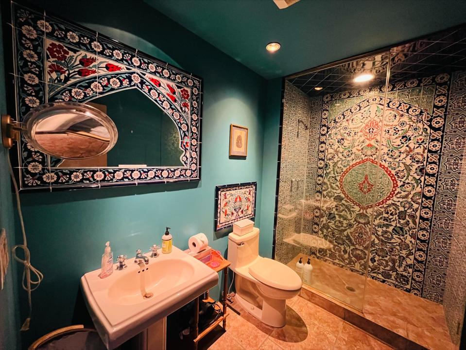 The Egyptian-themed guest bathroom