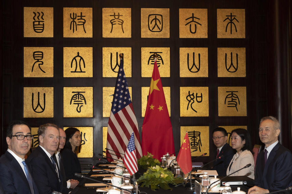 CORRECTS SPELLING TO STEVEN INSTEAD OF STEVE - Chinese Vice Premier Liu He, right, sits with U.S. Trade Representative Robert Lighthizer, second from left, and Treasury Secretary Steven Mnuchin, left, before the start of talks at the Xijiao Conference Center in Shanghai Wednesday, July 31, 2019. (AP Photo/Ng Han Guan, Pool)