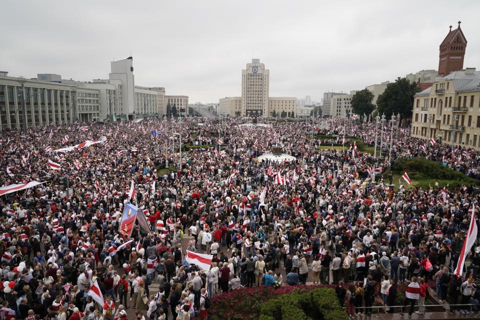 FILE - Belarusian opposition supporters rally at Independence Square in Minsk, Belarus on Aug. 23, 2020. Hundreds of thousands of Belarusians who fled repression at home face the prospect of having invalid documents after authoritarian President Alexander Lukashenko signed a decree halting passport renewals abroad. Many of these self-exiles left Belarus amid a harsh government crackdown over the disputed 2020 presidential election, and returning means they risk being arrested. (AP Photo/Evgeniy Maloletka, File)