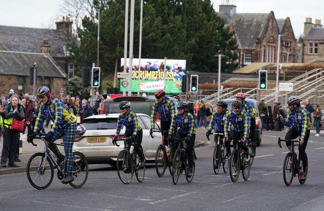 Former Scotland captain Rob Wainwright arrives with the match ball after a team of rugby legends cycled 555 miles in 48 hours in a fundraising event for research into motor neurone disease ahead of the Guinness Six Nations match at BT Murrayfield, Edinburgh, Scotland