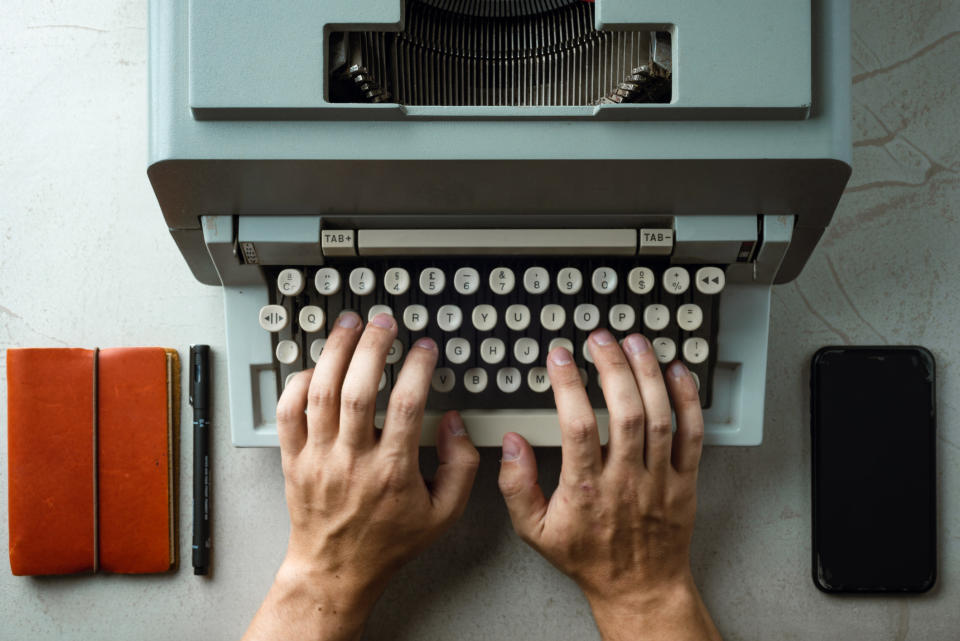 Someone using a typewriter