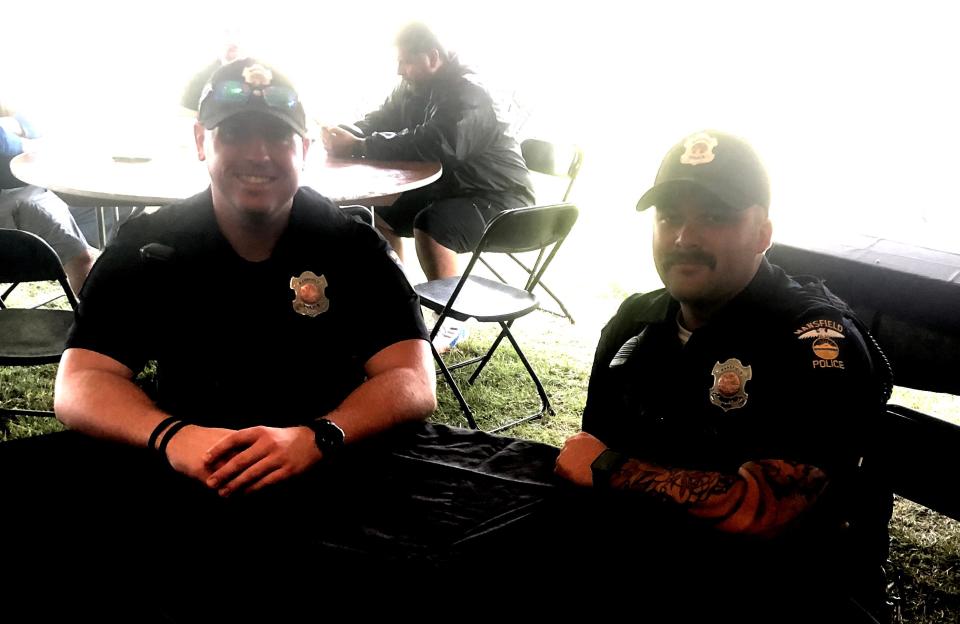Mansfield police officers Blake Bammann, left, and Kody Leitz said the INKcarceration was "pretty relaxed."