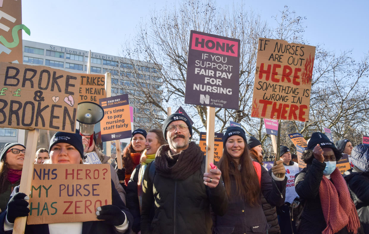 LONDON, UNITED KINGDOM - 2023/02/07: Nurses hold placards in support of fair pay during the demonstration at the picket outside St Thomas' Hospital, as thousands of NHS nurses continue their strikes over pay. (Photo by Vuk Valcic/SOPA Images/LightRocket via Getty Images)