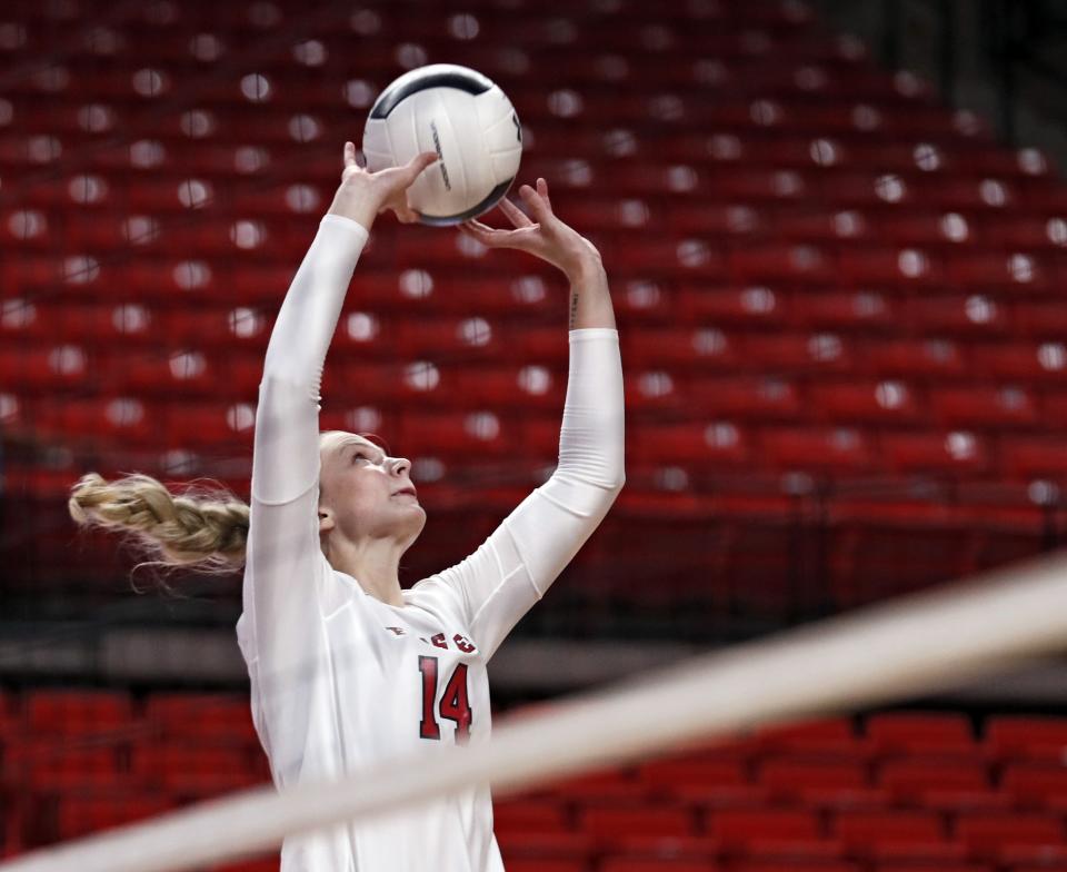 Texas Tech's Tatum Rohme (14) sets the ball during the match against West Virginia, Wednesday, Sept. 25, 2019, at United Supermarkets Arena in Lubbock, Texas. [Brad Tollefson/A-J Media]
