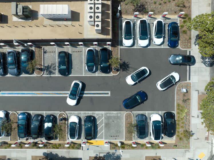 SANTA MONICA, CA - AUGUST 20: Teslas come and go at the supercharging station at 1425 Santa Monica Boulevard in Santa Monica. Paul Scott, co-founder of Plug in America, an electric car advocacy group, was instrumental in getting a Tesla charging station built at this location. There are currently 26 superchargers with another 36 soon opening in an adjacent lot. Photographed on Saturday, Aug. 20, 2022. (Myung J. Chun / Los Angeles Times)