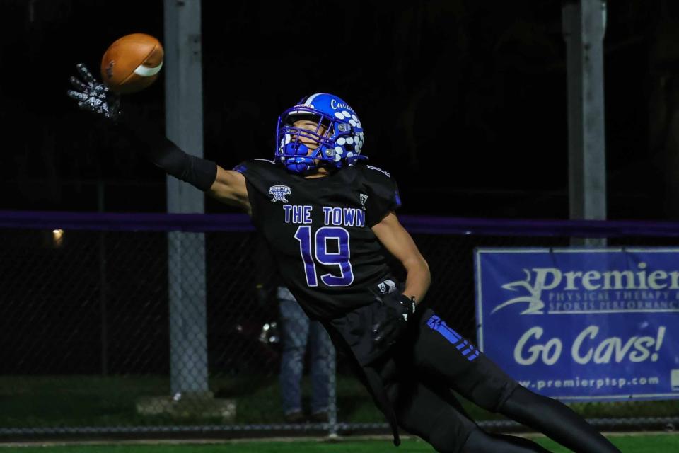 Middletown Cavaliers defensive back Jacobi Rodgers (19) dives for the ball during a regular season game between Appoquinimink and Middletown Friday, Nov. 10, 2023, at Cavalier Stadium, in Middletown, DE.