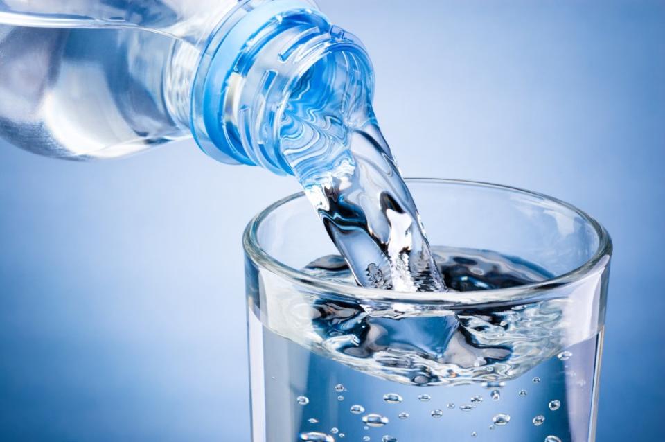 Certain water filtration systems can remove PFAS from your drinking water — but boiling water or just buying bottled water won’t necessarily help you avoid them. Hyrma – stock.adobe.com