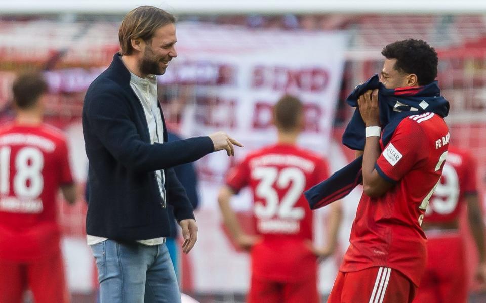 Tim Steidten speaks with Serge Gnabry - GETTY IMAGES