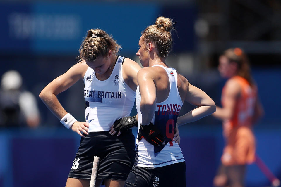 TOKYO, JAPAN - AUGUST 04: (EDITOR’S NOTE: Alternative crop of image #1332244689) Susannah Townsend and Lily Owsley of Team Great Britain react after losing the Women's Semifinal match between Netherlands and Great Britain on day twelve of the Tokyo 2020 Olympic Games at Oi Hockey Stadium on August 04, 2021 in Tokyo, Japan. (Photo by Dan Mullan/Getty Images)