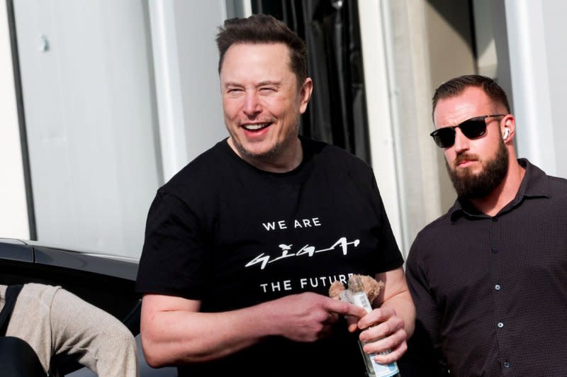 Tesla CEO Elon Musk visits the Tesla electric car plant in Brandenburg near Berlin, Germany in March. The factory on Friday was the sight of a battle with police and climate activists who were protesting the expansion of the plant. Police said they became involved after some protesters attempted to breach the factory grounds. File Photo by Filip Singer/EPA-EFE