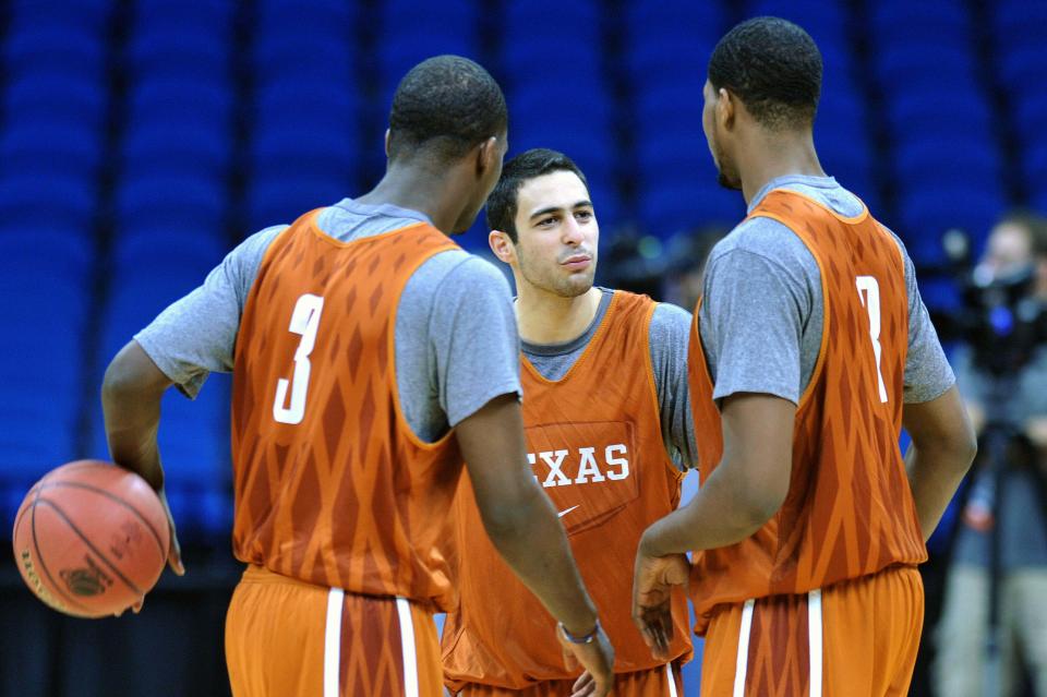 Texas guard Dogus Balbay, center, talks to teammates Jordan Hamilton and Tristan Thompson during a practice in the 2011 NCAA Tournament. "He was one of my all-time favorite players," current UT coach Rodney Terry said of Balbay.