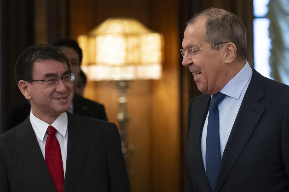 Russian Foreign Minister Sergey Lavrov, right, and Japanese Foreign Minister Taro Kono enter a hall for their talks in Moscow, Russia, Monday, Jan. 14, 2019. (AP Photo/Alexander Zemlianichenko)