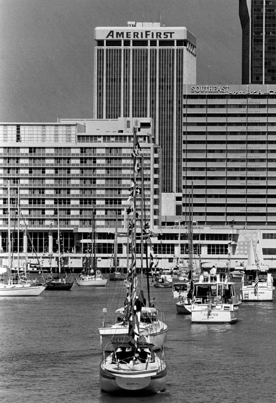 Boat parade on Brickell Point, with downtown Miami in the background.