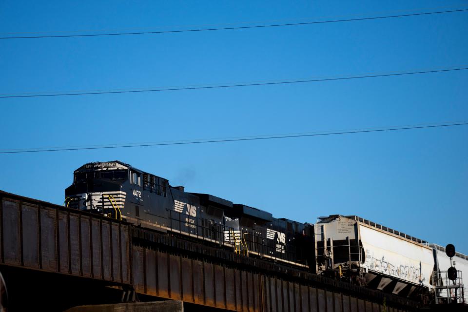 A Norfolk Southern train rides on a line through Union Terminal in Cincinnati. Cincinnati Mayor Aftab Pureval wants to sell the Cincinnati Southern Railway to Norfolk Southern Corp, a decision that will up to voters in November. Proceeds from the sale will be used to create a trust that helps pay for city infrastructure needs -- like street repair and repaving.