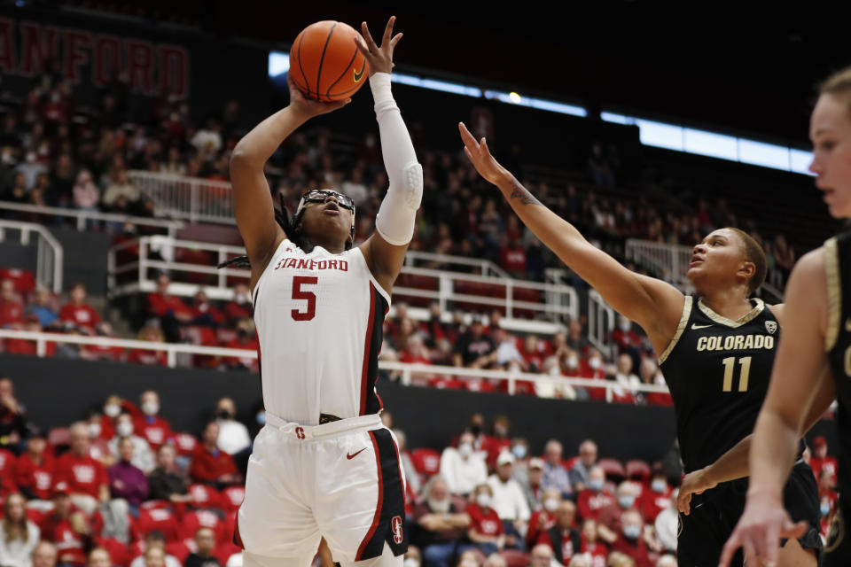 Stanford forward Francesca Belibi (5) shoots against Colorado center Quay Miller (11) during the first quarter of an NCAA college basketball game in Stanford, Calif., Sunday, Jan. 22, 2023. (AP Photo/Jim Gensheimer)