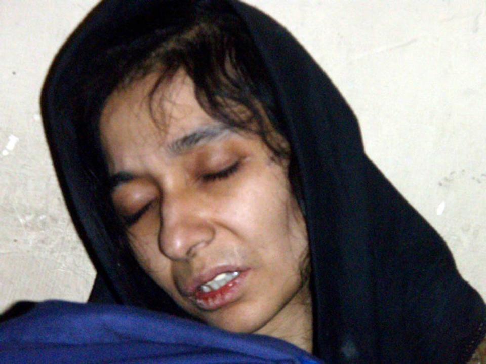 FILE - In this July 17, 2008 file photo, Aafia Siddiqui is seen in the custody of the Counter Terrorism Department of Ghazni province in Ghazni City, Afghanistan.