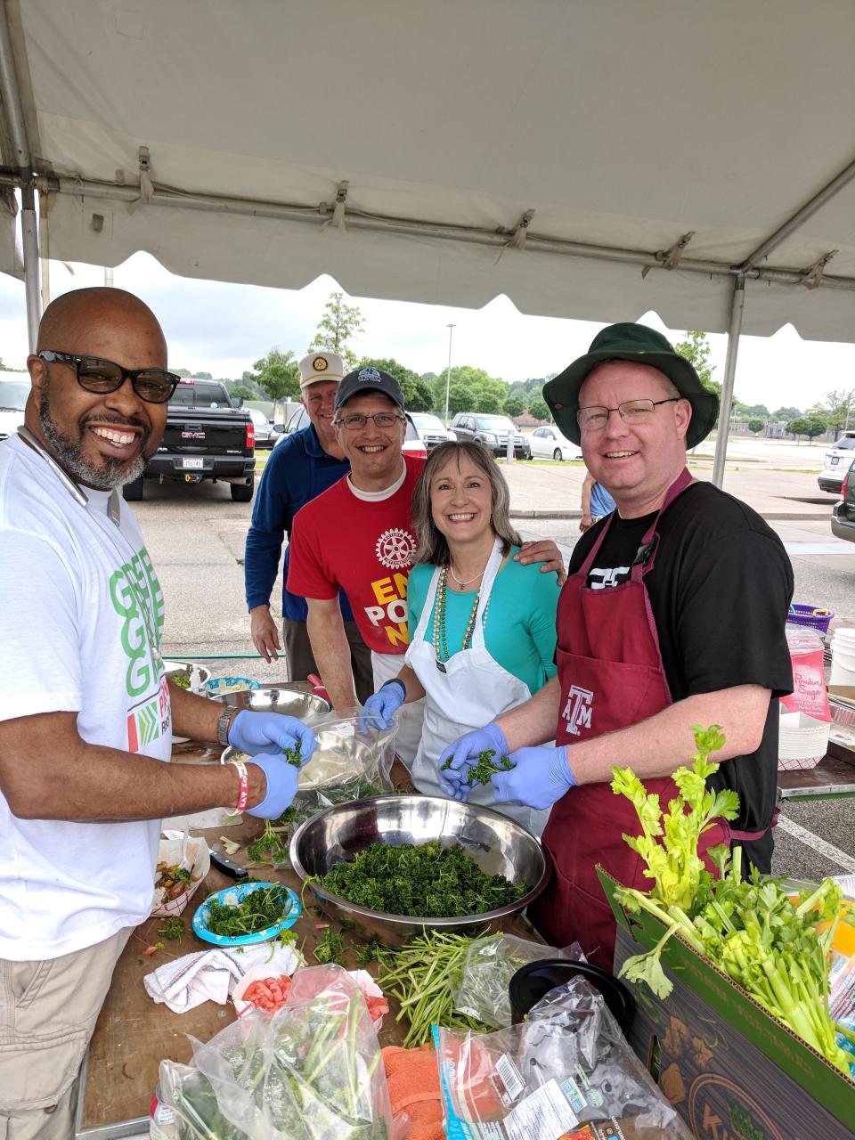 Rotary Club of Memphis volunteers prepare authentic New Orleans Shrimp & Grits and Beignets for their annual Cafe du Monde event.