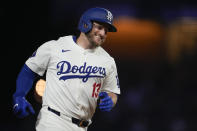 Los Angeles Dodgers' Max Muncy runs the bases after hitting a home run during the eighth inning of a baseball game against the Atlanta Braves in Los Angeles, Saturday, May 4, 2024. (AP Photo/Ashley Landis)