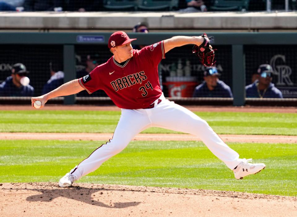 Arizona Diamondbacks relief pitcher Mark Melancon (34) throws to the Seattle Mariners in the fourth inning during a spring training game at Salt River Fields in Scottsdale on March 3, 2023.