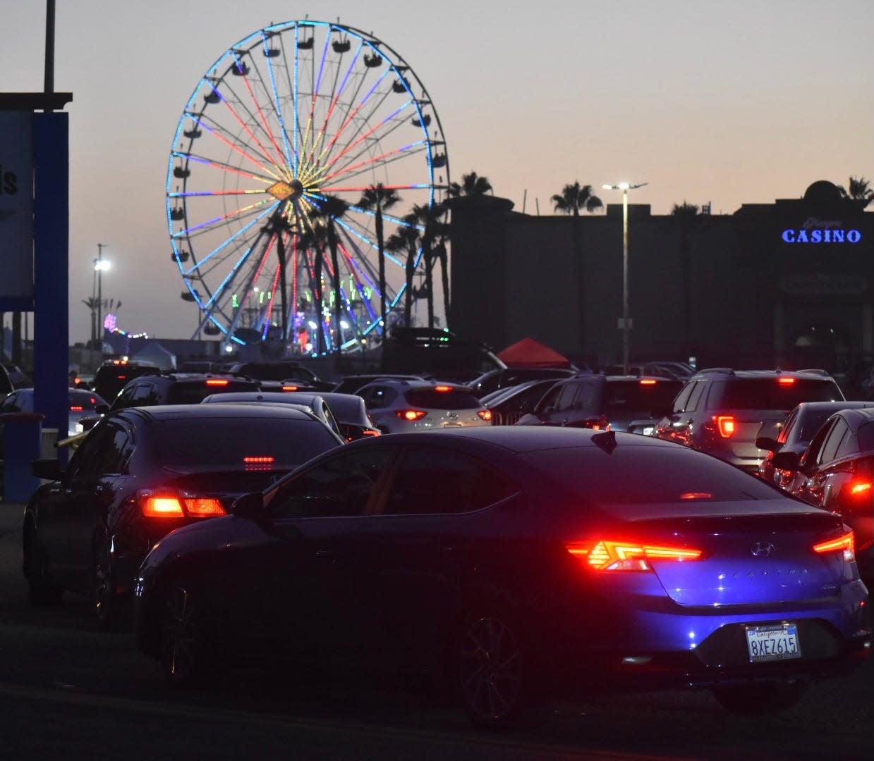 Cars stream into the Ventura County Fairgrounds Saturday night. Officials said attendance for the first five days of the fair is up over last year.