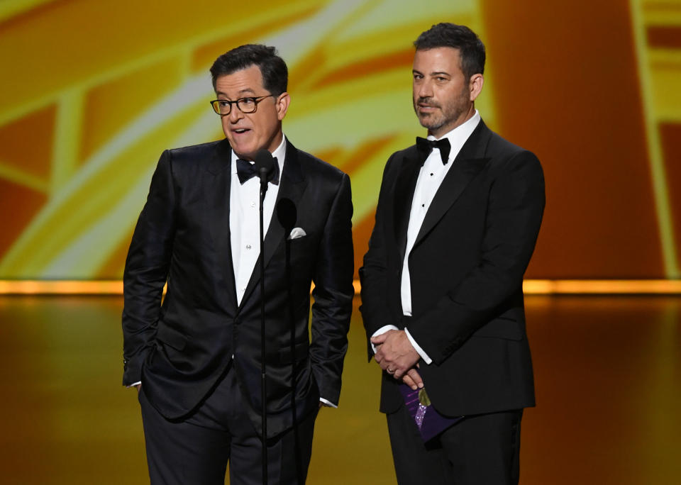 LOS ANGELES, CALIFORNIA - SEPTEMBER 22: (L-R) Stephen Colbert and Jimmy Kimmel speak onstage during the 71st Emmy Awards at Microsoft Theater on September 22, 2019 in Los Angeles, California. (Photo by Kevin Winter/Getty Images)