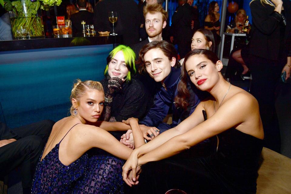 Imagine being cool enough to sit with this crew? Stella Maxwell, Billie Eilish, Finneas O'Connell, Timothée Chalamet, and Sara Sampaio congregate at the Vanity Fair Oscar Party. 