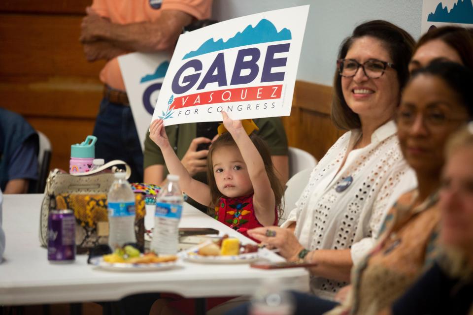 Representative Gabe Vasquez's niece holds up a sign during a reelection event for Gabe Vasquez on Saturday, Sept. 16, 2023, at the Mesilla Community Center.