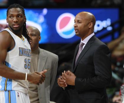 Kenneth Faried and Brian Shaw share a tender moment. (AP/David Zalubowski)