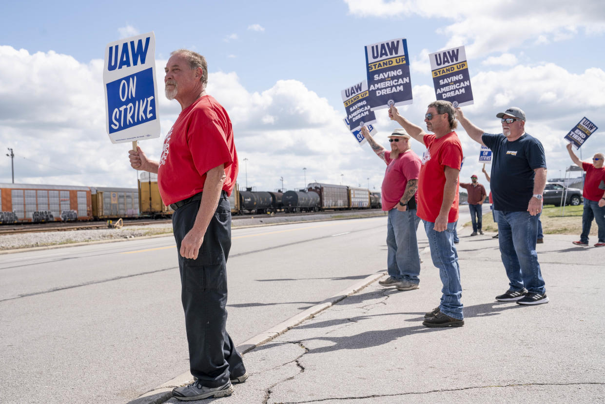 Ed Clark (L) and other United Auto Workers members picket outside the Jeep Plant gate that management uses on September 18, 2023 in Toledo, Ohio.