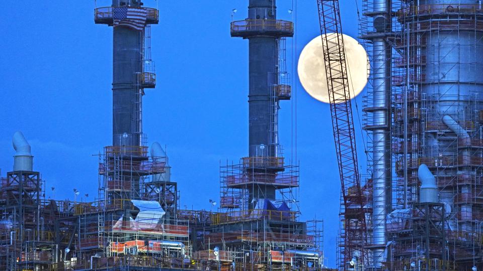 A full moon rises behind the Shell Pennsylvania Petrochemicals Complex, an ethylene cracker plant located in Potter Township, Pennsylvania, on the shore of the Ohio River on March 17, 2022.