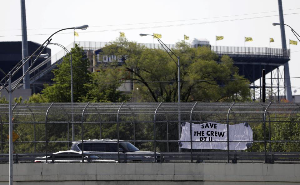A "Save the Crew" sign hangs over the I-71 Hudson Street bridge in Columbus in 2021.