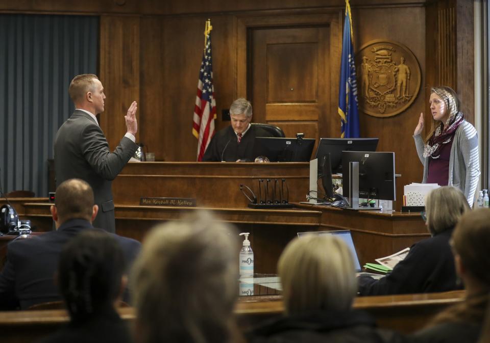 Shane Nolan is sworn in before taking the witness stand on Thursday, February 1, 2024, at the Brown County Courthouse in Green Bay, Wis. Nolan stands accused of throwing a woman into an active fire pit on July 3, 2021.