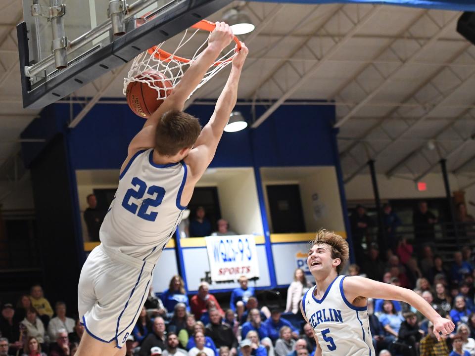 Berlin Brothersvalley's Pace Prosser (22) hangs on after throwing down a dunk as teammate Haydon Hutzell looks on against Conemaugh Valley in a PIAA Class 1A first-round boys basketball contest, March 8, at Pitt-Johnstown.