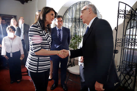 U.S. Ambassador to the United Nations Nikki Haley shakes hands with Commissioner Ivan Velasquez at the offices of the International Commission Against Impunity in Guatemala (CICIG), in Guatemala City, Guatemala February 28, 2018. REUTERS/Luis Echeverria