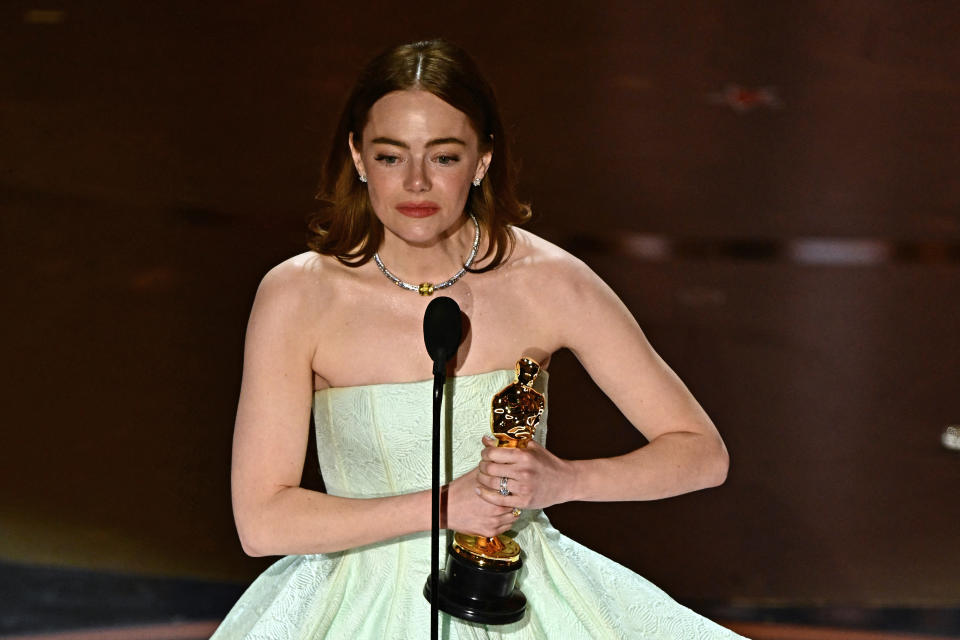 US actress Emma Stone accepts the award for Best Actress in a Leading Role for 