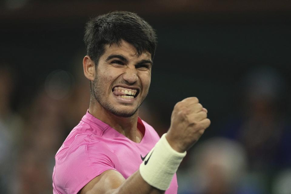 Carlos Alcaraz, of Spain, reacts after winning a game over Felix Auger-Aliassime, of Canada, at the BNP Paribas Open tennis tournament Thursday, March 16, 2023, in Indian Wells, Calif. (AP Photo/Mark J. Terrill)
