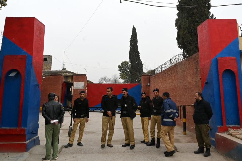 Police personnel stand outside the entrance of Adiala Jail during the hearing of jailed former Pakistan's Prime Minister Imran Khan, in Rawalpindi (EPA)