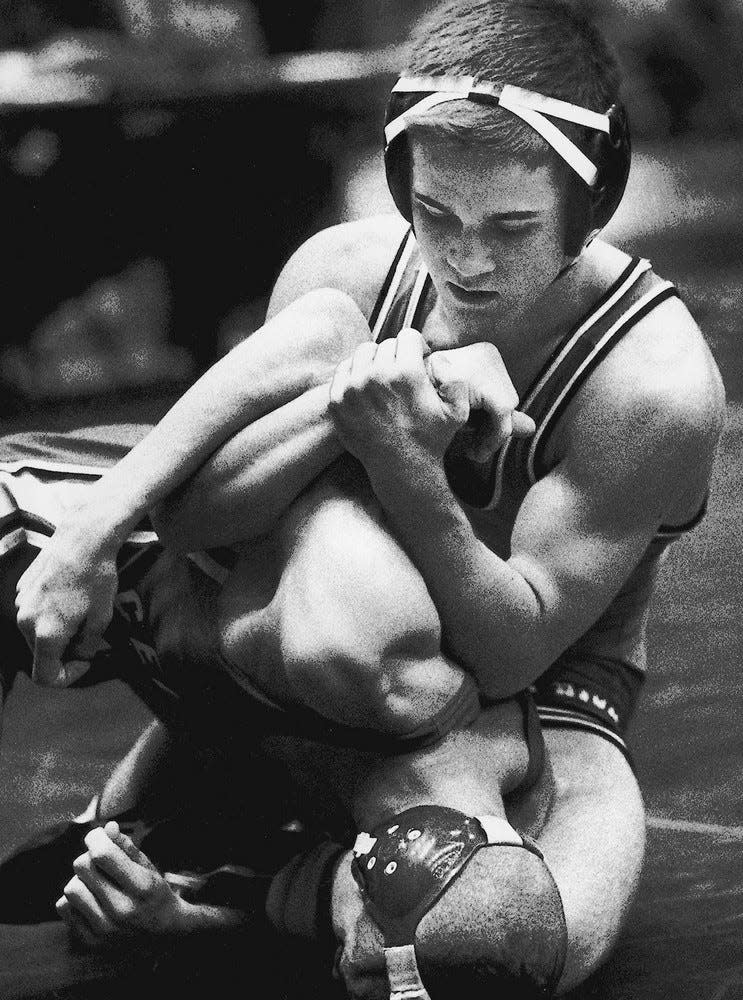 1992: Jeff McGinness of Iowa City High (top) becomes the ninth wrestler to win a fourth state crown in 1993. He is pictured in wrestling Joe Crum of Cedar Falls.