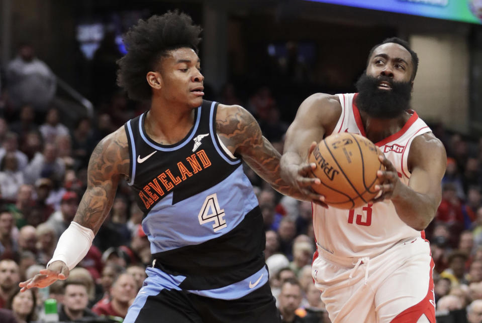 Houston Rockets' James Harden (13) drives past Cleveland Cavaliers' Kevin Porter Jr. (4) in the second half of an NBA basketball game, Wednesday, Dec. 11, 2019, in Cleveland. Houston won 116-110. (AP Photo/Tony Dejak)