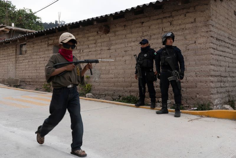 The Wider Image: "Under siege": Inside Mexican village where children are armed