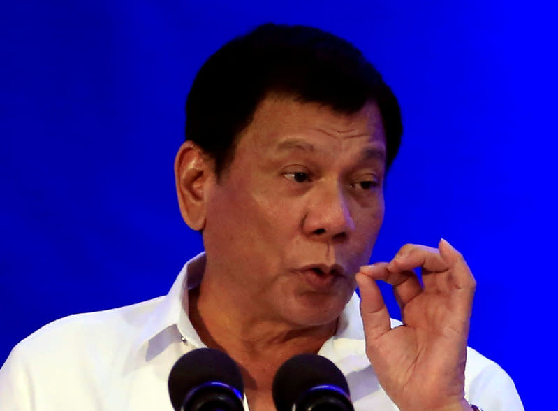 Philippine President Rodrigo Duterte gestures while delivering a speech during the 80th National Bureau of Investigation (NBI) founding anniversary at the NBI headquarters in metro Manila, Philippines November 14, 2016. REUTERS/Romeo Ranoco