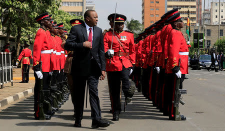 FILE PHOTO: Kenya's President Uhuru Kenyatta inspects the honour guard before the opening of the 12th Parliament outside the National Assembly Chamber in Nairobi, Kenya September 12, 2017. REUTERS/Thomas Mukoya